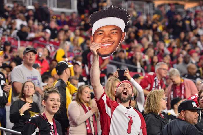 A fan holds a Arizona Cardinals quarterback Kyler Murray (1) sign prior to the game against the Pittsburgh Steelers at State Farm Stadium.